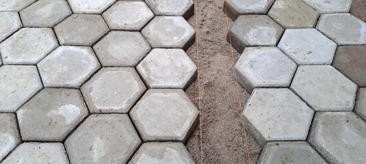 Installation of hexagon paving. Construction tools and details, paving installing with rubber...