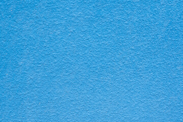 Blue cement wall texture for background and copy space for text.