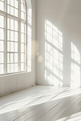 Fototapeta premium White minimalistic room with blank walls and sunlight streaming through windows. Creating a background of sun rays and shadows