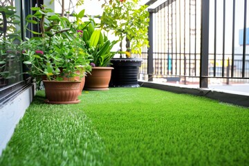 artificial turf balcony garden with potted plants
