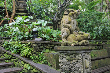 Pigs sculpture in Sacred Monkey Forest Sanctuary, Bali, Indonesia