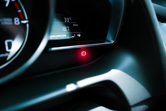 Brake warning light illuminated on instrument panel in a car , Automotive maintenance concept