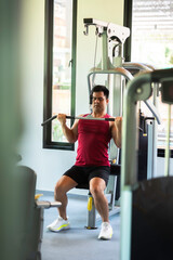 Asian man exercise in the gym. Healthy and Lifestyle Concept.Strength and motivation, sport,...