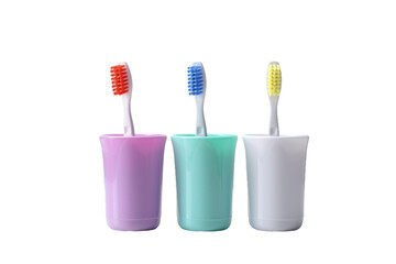 Trio of Vibrant Toothbrushes Nestled in a Ceramic Cup. On a Clear PNG or White Background.