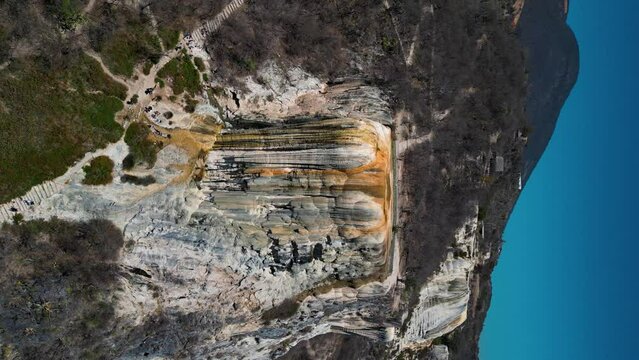 wide view of hierve el agua waterfall, vertical drone sight in oaxaca, mexico