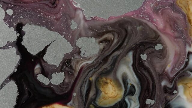 Closeup motion video of rupture of fluid materials on boiling.