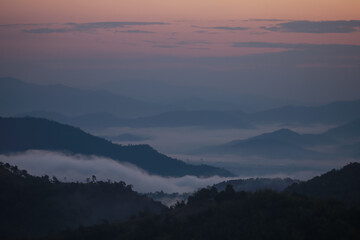 Background image of a morning landscape on a mountaintop with mountains and a sea of ​​mist...