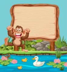 Tuinposter Happy monkey with ducks and signboard by the pond © GraphicsRF