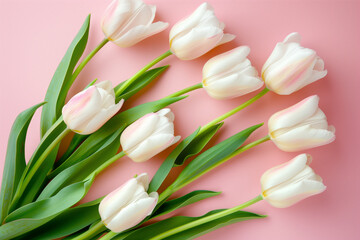 Beautiful composition spring flowers. Bouquet of pink tulips flowers on pastel pink background. Valentine's Day, Easter, Birthday, Happy Women's Day, Mother's Day. Flat lay, top view, copy space