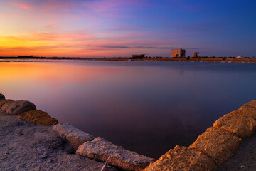 calm sea salt basins and flats near Trapani and Paceco at sunset