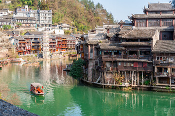 Feng Huang Ancient Town (Phoenix Ancient Town) and tourist boats on Tuo Jiang River, The famous...