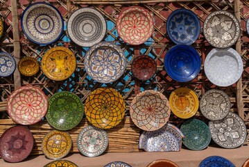 colorful bowls and platters on display in a traditional Moroccan arts and crafts shop