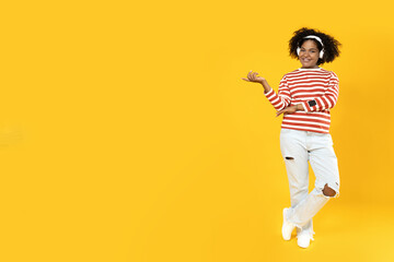 Young African American woman listening to music in headphones