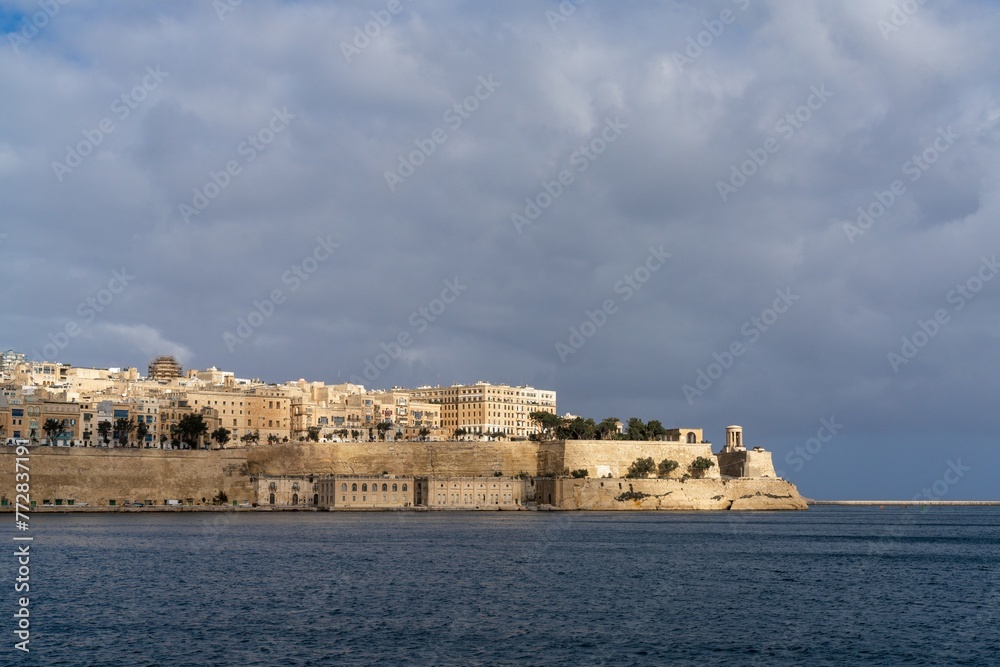 Wall mural view of downtown Valletta and St. Elmo's Fire under an overcast sky