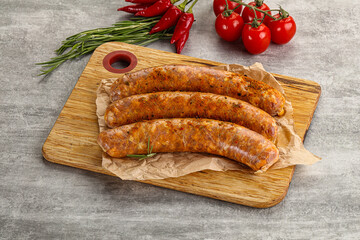 Raw sausages with spices and herbs