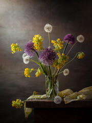 Modern still life with a bouquet of wildflowers on a dark background