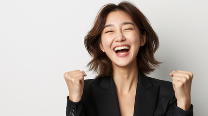 Successful Korean businesswoman clenches her fists and cheers with a happy expression. Asian female job applicant rejoicing over passing. Isolated on white background. Copy space. Generative AI