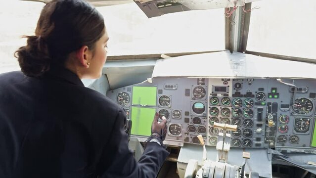 A woman is piloting an airplane