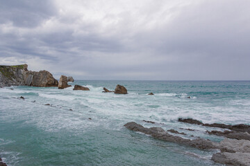 Coastal landscape with cliffs and waves. Copy space.