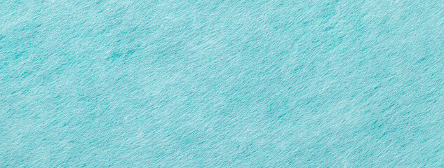 Texture of light blue and turquoise color background from felt textile, macro. Vintage cerulean fabric cloth