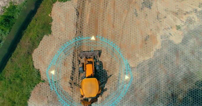 The concept of a smart grader. A smart construction site. The grader works at the construction site. Visualization of smart construction