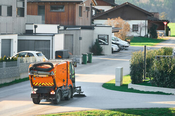 Neighborhood Cleanup with Orange Broom Sweeper