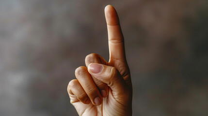 a hand with a finger pointing up