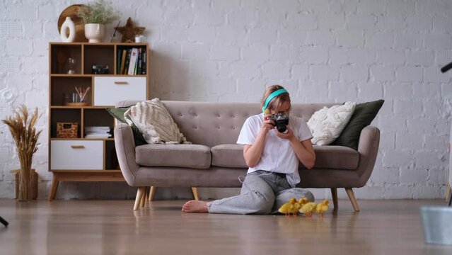 Full body photo of happy pretty girl sit floor inside home indoors with chicks