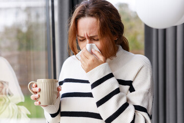 Young woman suffering from cold