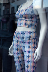Closeup of fitness clothes on mannequin in a fashion store showroom - 772906142