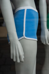 Closeup of blue shorty on mannequin in a fashion store showroom - 772906750