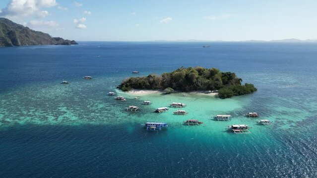 Island Hopping Boats at Reef of CYC Island in Coron, Aerial Dolly Zoom in