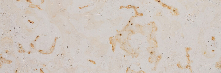 Dolomite texture. Natural rock with beautiful beige patterns on the surface. Polished flat stone. Classic luxury decoration building material. Wide panoramic texture for background and design.