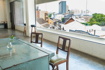 Empty Table and chair in Korean restaurant or minimal cafe style with view of city in seoul korea,cafe japan or korea concept.