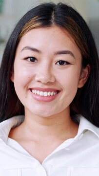 Vertical closeup portrait of eastern young asian woman happily smiling looking at camera in home office interior. Headshot of Korean beautiful millennial businesswoman entrepreneur, remote freelancer