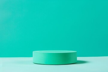 Minimalist mint green cylindrical podium on a matching backdrop, Concept of product display, simplicity, and modern design