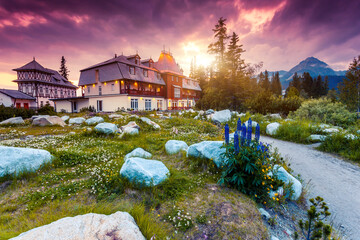 A charming evening view of the resort settlement near Strbske pleso.