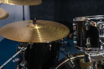 Close-up of a fragment of a musical installation. Musical cymbals of a drum kit in the studio, at a concert