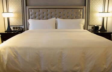 Fototapeta na wymiar Luxury Modern Bedroom Interior With Pillow Table Lamp