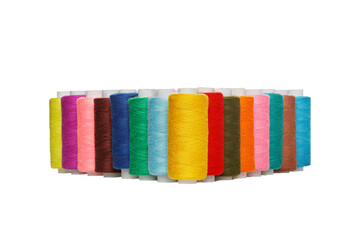 multi-colored spools of sewing thread on a white background close-up