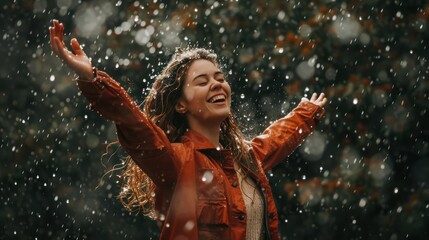 A woman feeling happy and carefree while dancing in the rain.