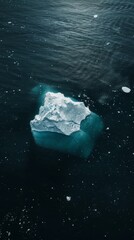 Aerial view of an iceberg in dark waters