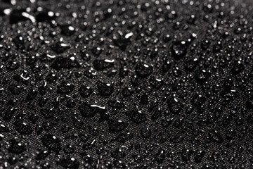 Close-up view on water drops on waterproof impregnated fabric in rain - obrazy, fototapety, plakaty