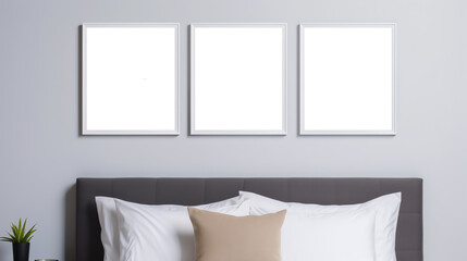 a bed with white pillows and a white square frame on the wall