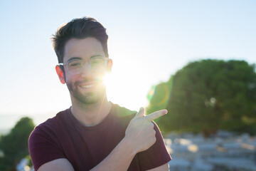 young man pointing aside