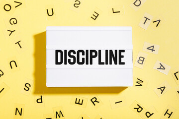 Discipline word written in letters on a lightbox
