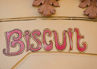 Old inscription on the wall Biscuit, made in vintage style
