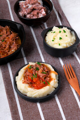 Stewed meat with potato mash served on the plate. Nutritious meal for lunch or dinner - 773008191