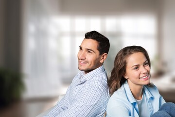 Loving cheerful couple cuddling at home