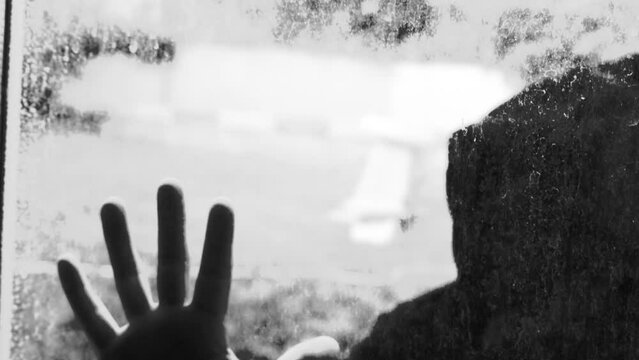 A scary amateur video of a man or a maniac with a knife, or an ax man climbing the steps in the dark. Horror, mysticism, crime, murderer.